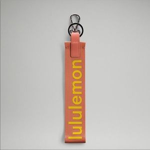 lululemon athletica Never Lost Coral Keychain with Yellow Logo